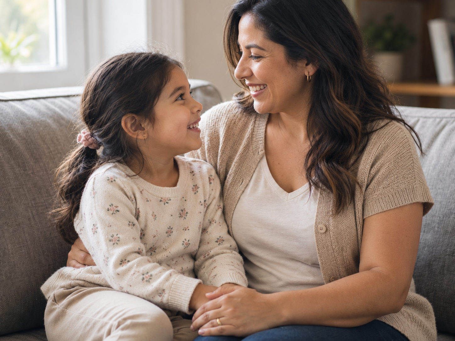 A mother and daughter smiling together